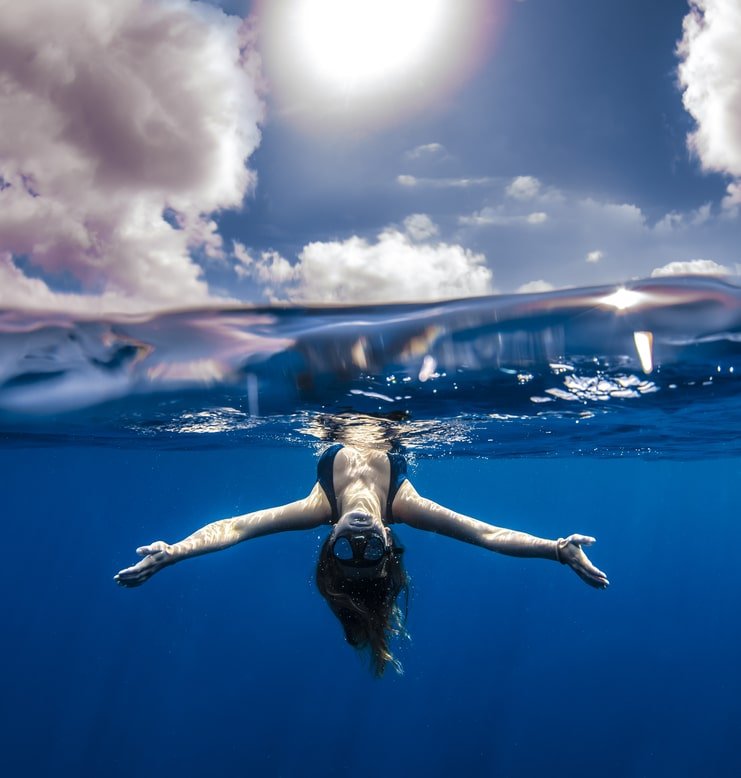picture of woman upside down in water