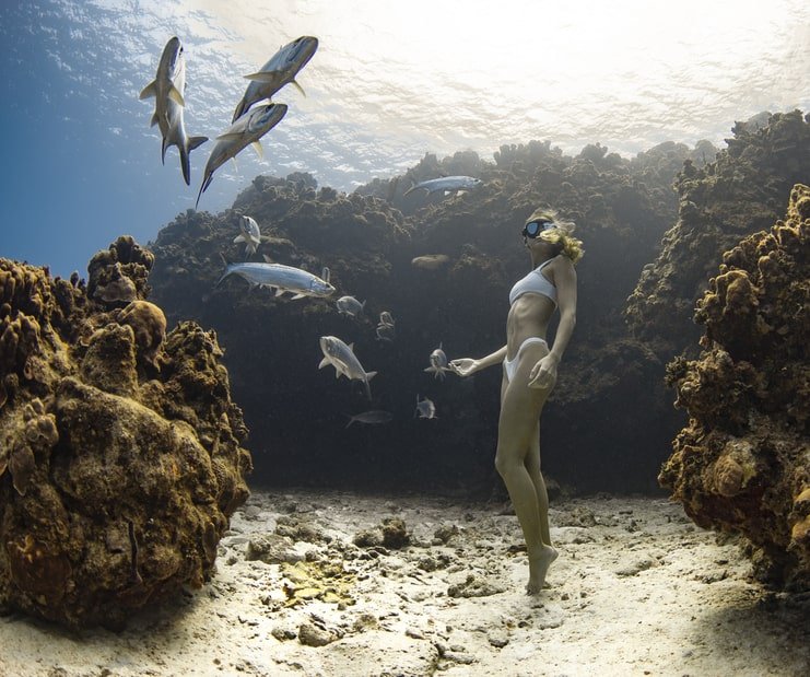 picture of woman underwater on sea floor